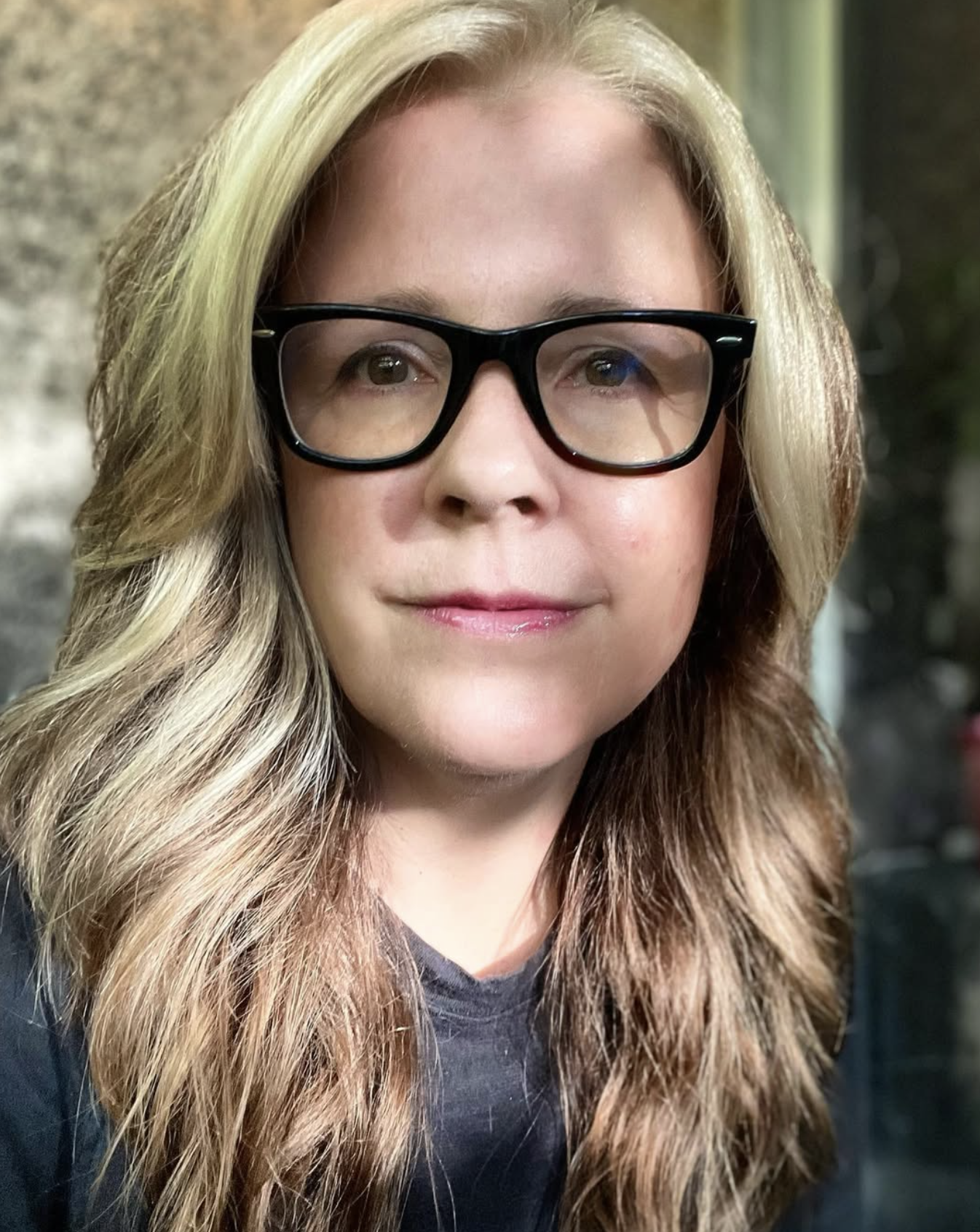 Carleigh Baker wearing black glasses